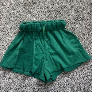 Green out from under shorts